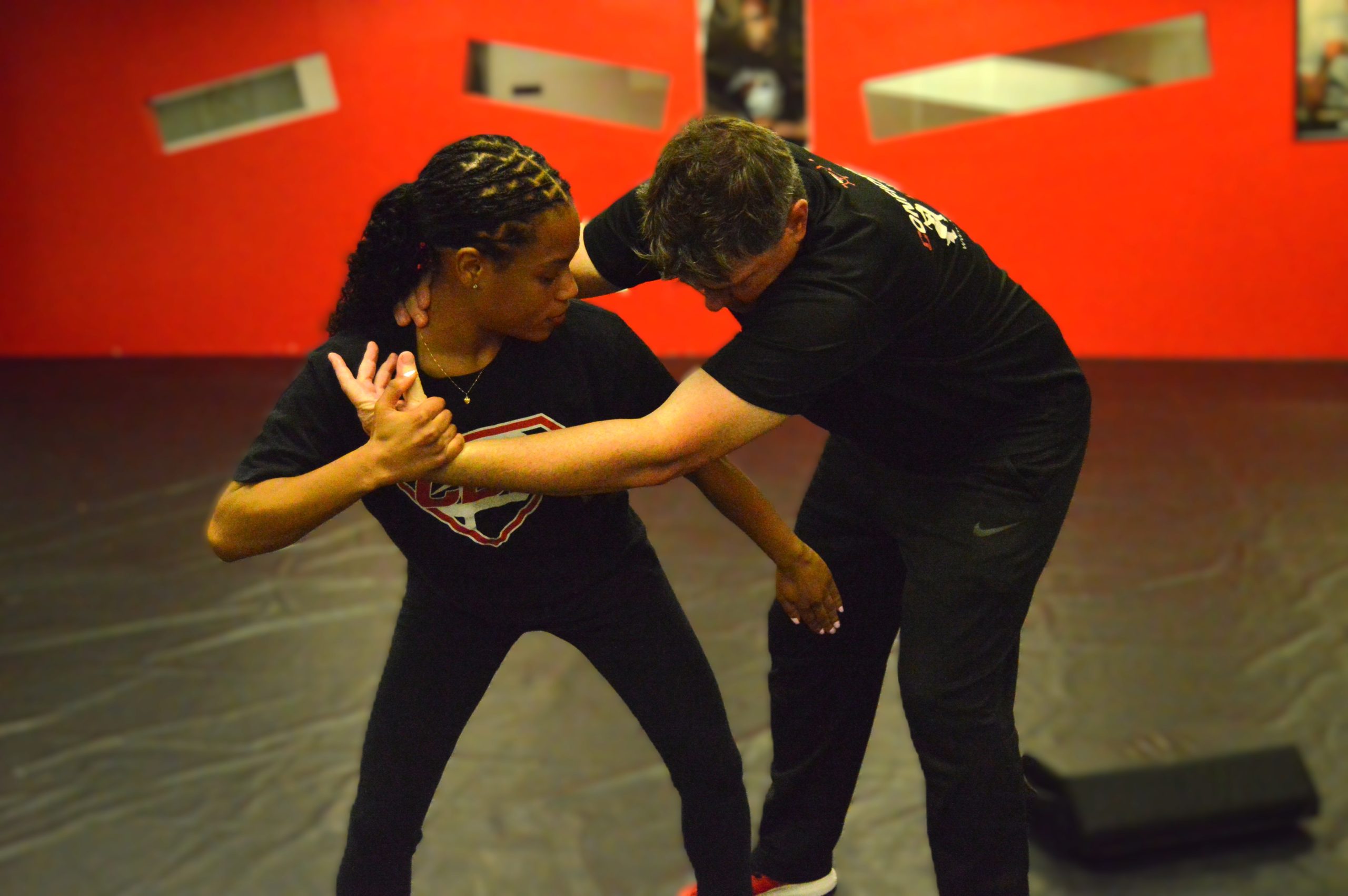 Student practicing a close-range escape technique during private self-defense and Krav Maga training in Bethesda, Maryland.