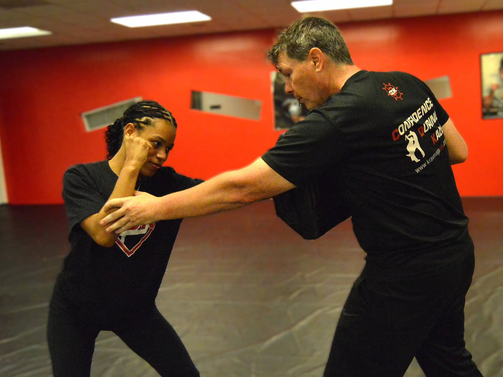 Student practicing a defensive arm-control technique during private self-defense and Krav Maga training in Bethesda, Maryland.